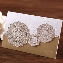 Lightly textured sleeve with a charming laser cut paper band enclosing an organic brown card printed in high rise fonts
